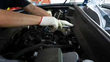 Mechanic working on vehicle