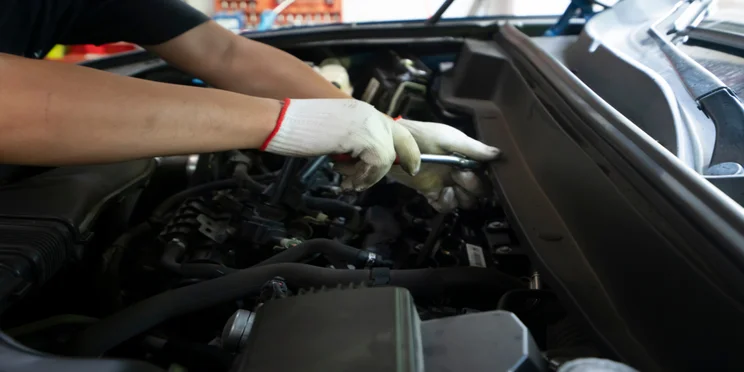Mechanic working on vehicle