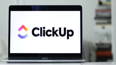 Laptop with ClickUp logo on the screen