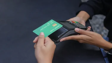 Person paying with credit card
