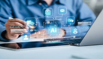 Person working on laptop with AI graphic in foreground