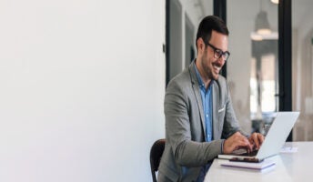 Person working on laptop in office