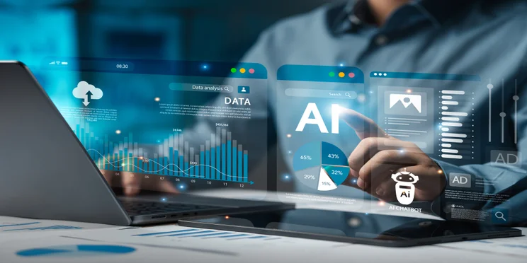 Man working at laptop with AI tools on screen