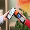 Person paying on mobile