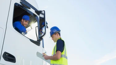 man assessing truck driver