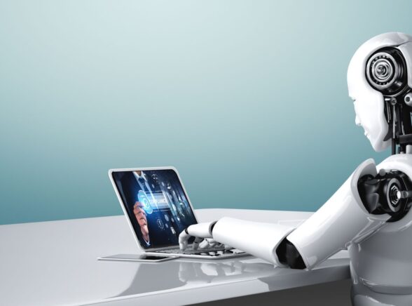 Robot Working on Laptop