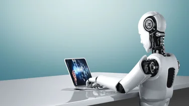 Robot Working on Laptop