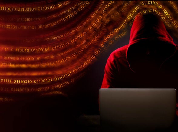 Hacker working on computer