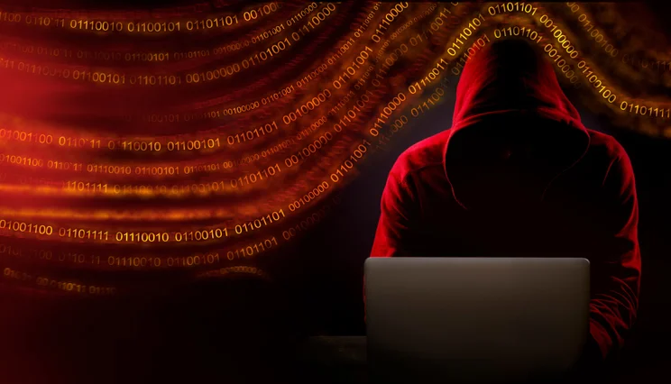 Hacker working on computer