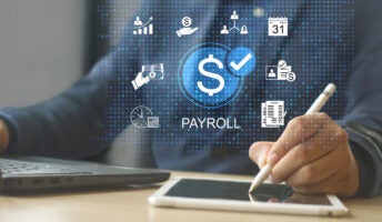 Person doing payroll on tablet