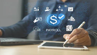 Person doing payroll on tablet