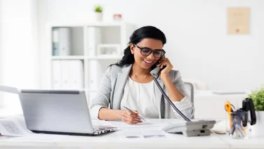 Woman on phone making business call