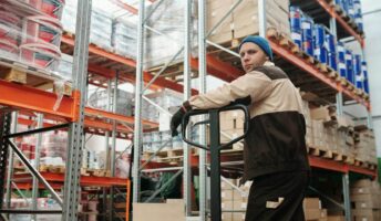Warehouse worker with boxes