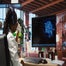 Woman working on computer with AI