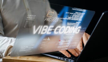Person vibe coding on laptop