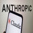 Anthropic logo on a wall, with Claude logo on a phone