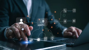Individual at desk using AI agents graphic