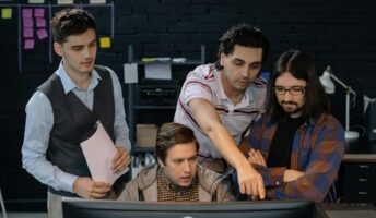 A project management team works on automations.