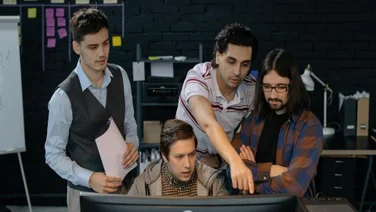 A project management team works on automations.