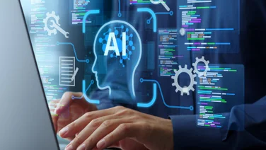 individual on laptop coding with AI