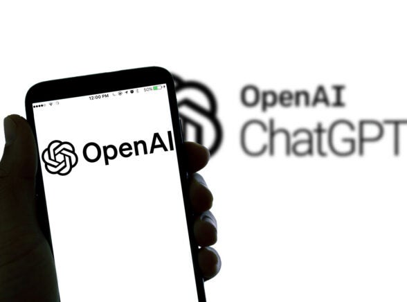 OpenAI logo on phone screen