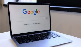 Google Search on laptop on desk