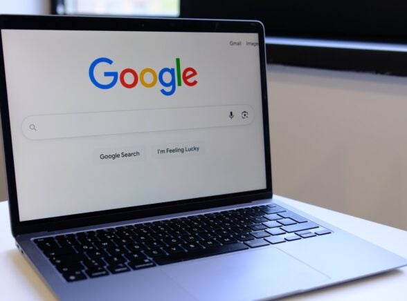 Google Search on laptop on desk