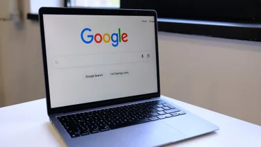 Google Search on laptop on desk