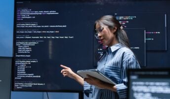 Woman presenting code work in office