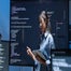 Woman presenting code work in office