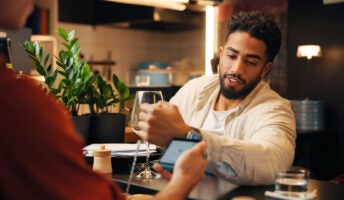 Person paying for items in restaurant