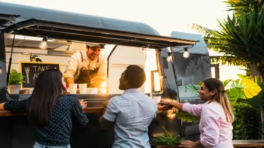 People queuing at food truck