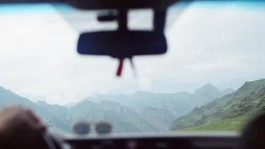 The road view from a truck dashboard