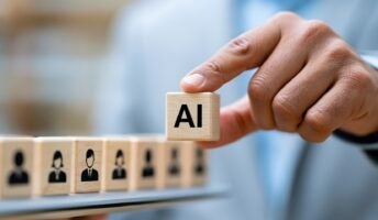 AI on wooden cubes with hand over candidates