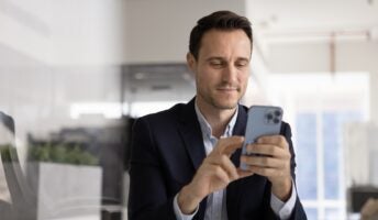 Male executive on phone in office