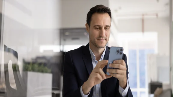 Male executive on phone in office