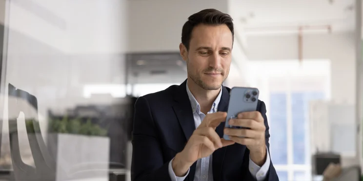 Male executive on phone in office