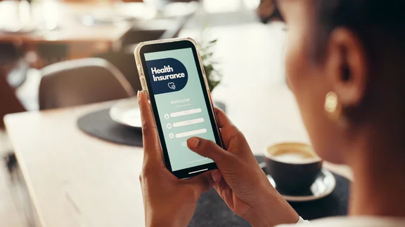 Person examining their health insurance on their phone