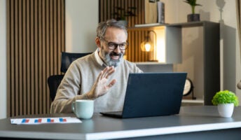 Man making call over the internet on laptop