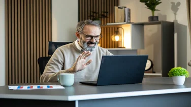 Man making call over the internet on laptop