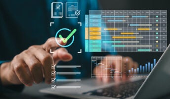 Person using project management software on laptop