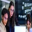 Workers around laptop technology