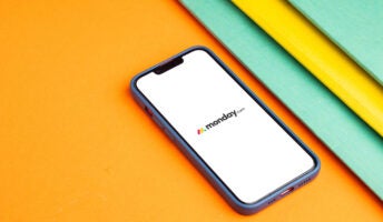 monday.com logo on phone screen