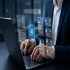 Office worker typing on laptop