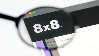 8x8 logo viewed through magnifying glass