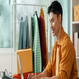 Man on laptop small business owner